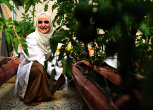 Proud Ne'ama in her greenhouse!