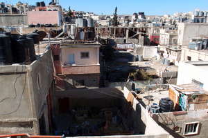 The camp; where greenhouses could cover the roofs.