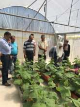 Officials visit a participating refugee