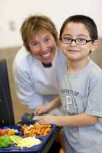 Chef Ann with a Student on the Lunch Line