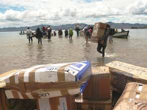 unloading donated medical supplies from the ferry