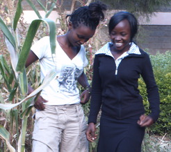 Girl beneficiary sharing with another girl
