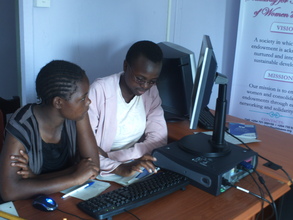 Girls learning computer skills