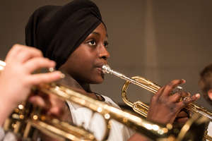 A student concentrates on music-making.