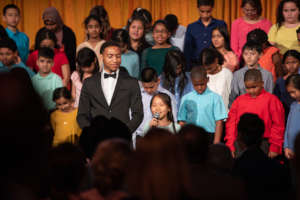 Brandon performs with an ETM partner school choir