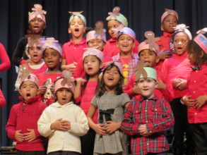 Students sing joyfully at a holiday concert!