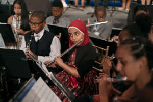 A flutist concentrates on her music-making!