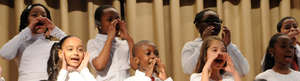 Students engage in gleeful singing