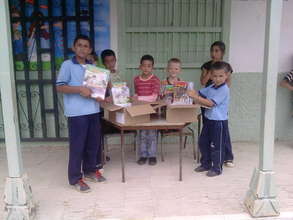 Students opening boxes with new school materials