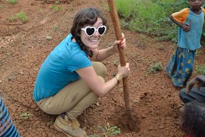 Tourist preparing plantation pit at the site