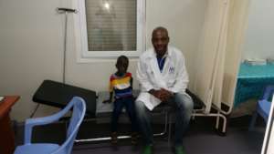 Emmanuel with Dr. Joseph one year after surgery