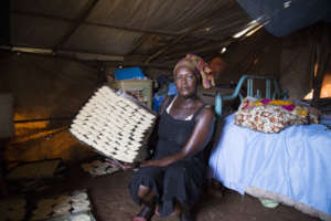 Sophia shows cookies she will sell in her shelter
