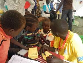 Children sign up to receive cholera vaccination