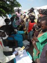 Families line up to receive vaccination cards