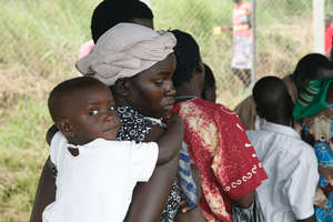 Happy baby safely behind mummy's back