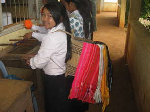 A PEI student with traditional Phnong handicrafts