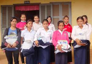 Secondary students with study materials/uniforms