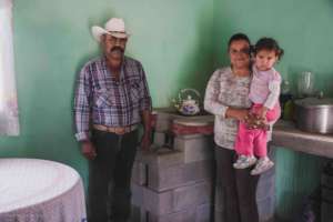 Family in Coahuila with wood-saving stove