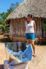 A woman trying out her new solar hotpot.