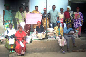 Munkunyu Group Picking up Initial Bean Seeds