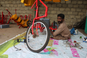 Imran Ghanchi works on the Accessible Tricycle