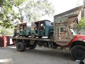 Our  rickshaws being moved to the new office
