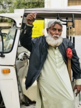 Akber holds the keys to his new Rickshaw!