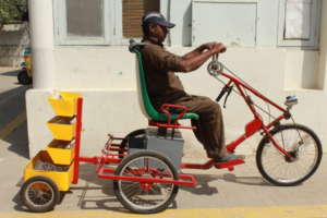 Khalid tries the accessible cycle prototype