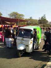 Our rickshaw navigating through a conference