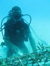 La Caleta fishermen cleaning a coral nursery
