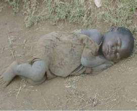 Street child sleeps on the road