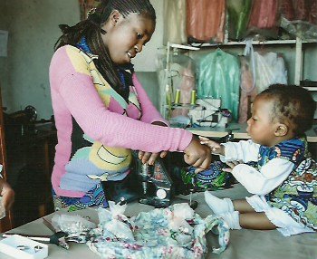 A teenage mother in work with her baby-CV