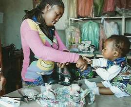 A teenage mother in work with her baby-CV