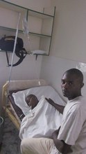 Ruphat with his father after his last surgery