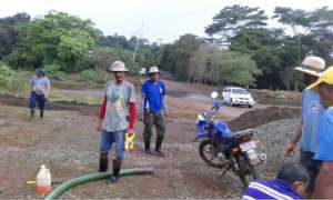 Community members working on the bridge
