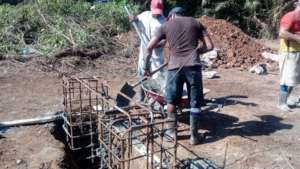 Community members working on the bridge3