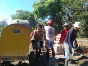 Community members working on the bridge 3