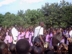 Moses engages kids and teachers at Kiwolera Army
