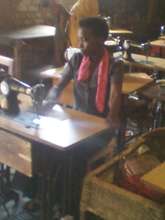 girl studing to sew cloths(dresses,shirt..)