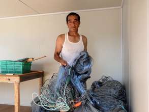 Ryuoichi Oikawa prepares salmon nets in new shed