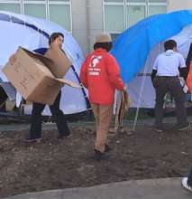 Helping evacuees move to government housing.