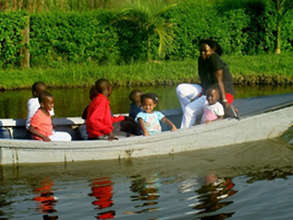 A family enjoys a boat ride during an outing