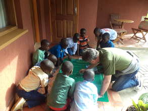 Children enjoy a game with a guest at the CV
