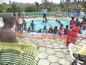 Children enjoy a splash in the cool water