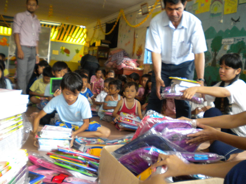 Presenting School Supplies to Children