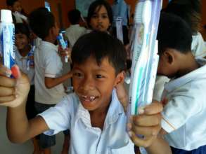 The children got toothpaste and toothbrushes