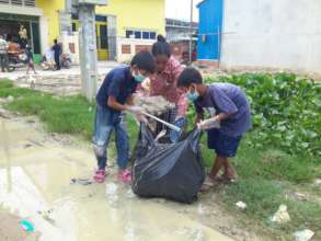 Children clean their community
