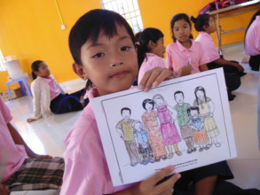 A boy showing his coloring picture