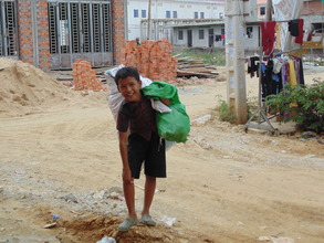 Children working as recycle trash collectors...
