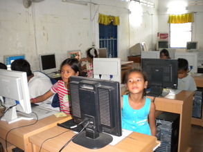 Children in computer lesson (Children Clubs)